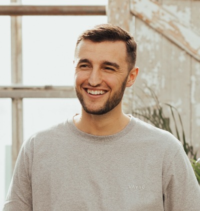 guy in gray shirt smiling