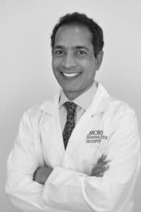 Dr. Ravi Singareddy a psychiatrist smiling in black and white
